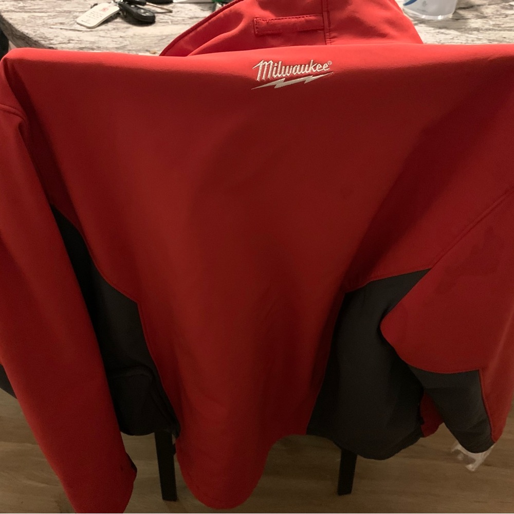 Red heated Milwaukee jacket clean works great battery and charger